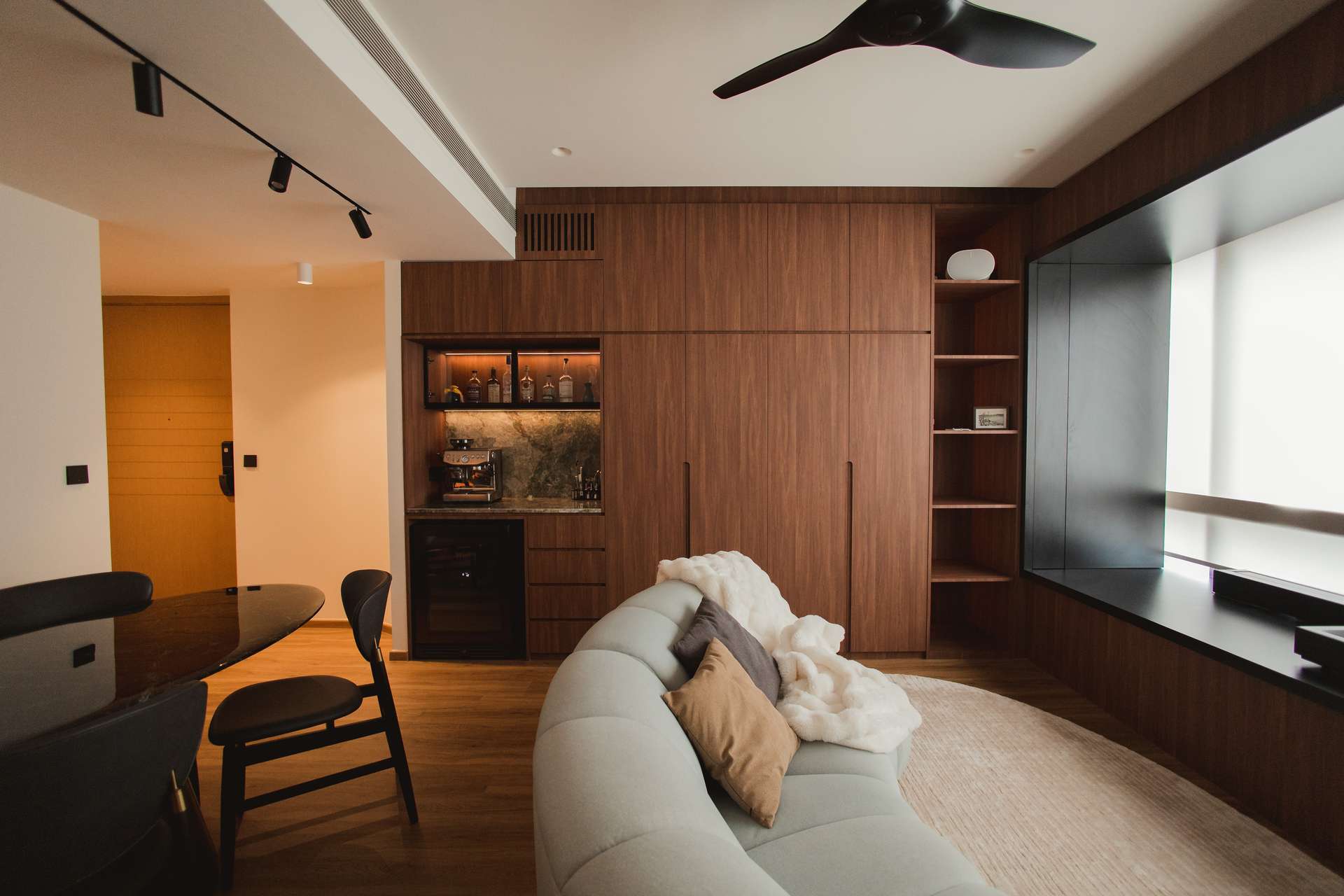 A GRITLINE interior with warm walnut joinery and bespoke built-ins